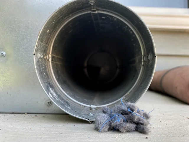 Lake Arrowhead Dryer Vent Cleaning technician using specialized equipment to clear severe dryer vent blockage in Lake Arrowhead